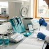 Technician preparing peptide samples in lab